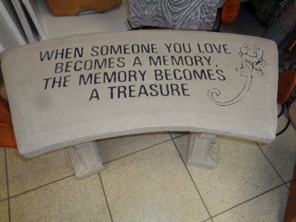 A TREASURE CEMENT GARDEN BENCH